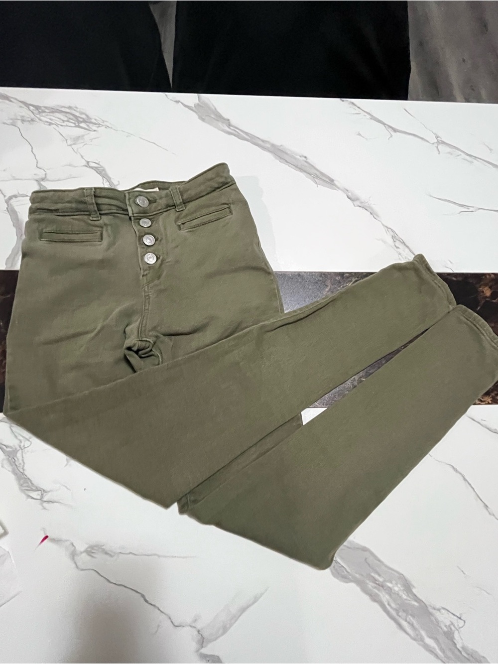 Wome’s high-rise Olive green jeans with a 4-button fly Levy Strauss 721 size 25